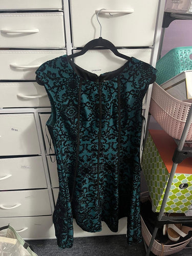 Detailed view of green fancy evening dress fabric